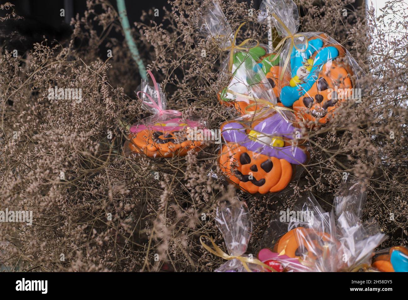 Pumpkin-shaped gingerbreads for Halloween. Edible Halloween decor.Halloween cookies in the shape of pumpkin, bat, ghost Stock Photo