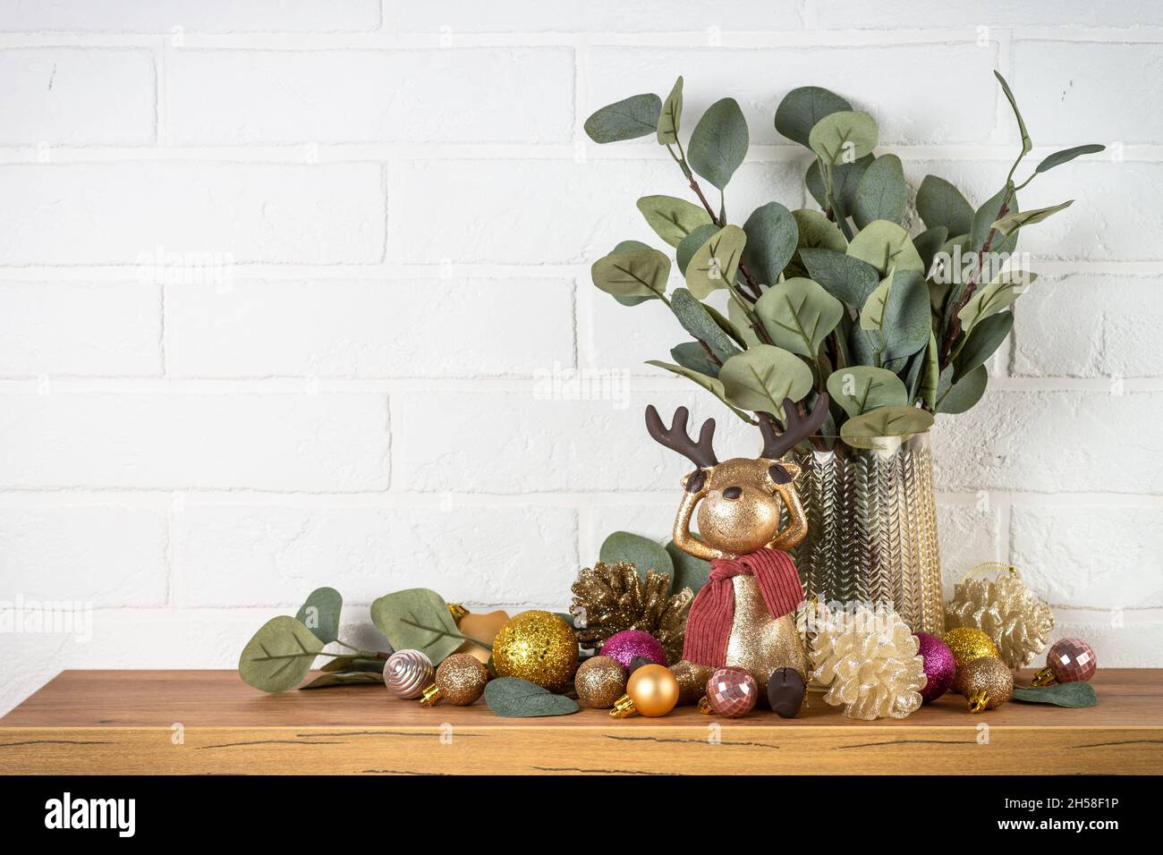 Christmas decorations indoor Shelf with candles, eucalyptus branches