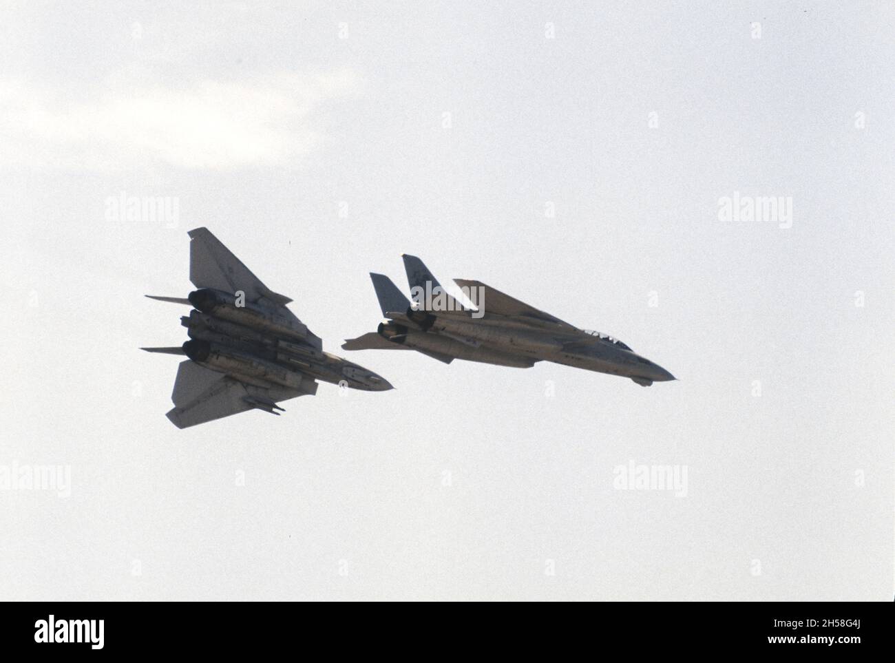 A pair of F-14's break for landing at NAS Miramar, California Stock Photo