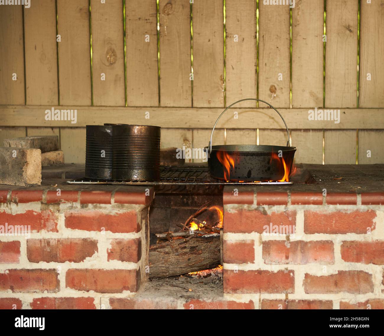 cooking fire with stew pot getting ready for meal Stock Photo - Alamy