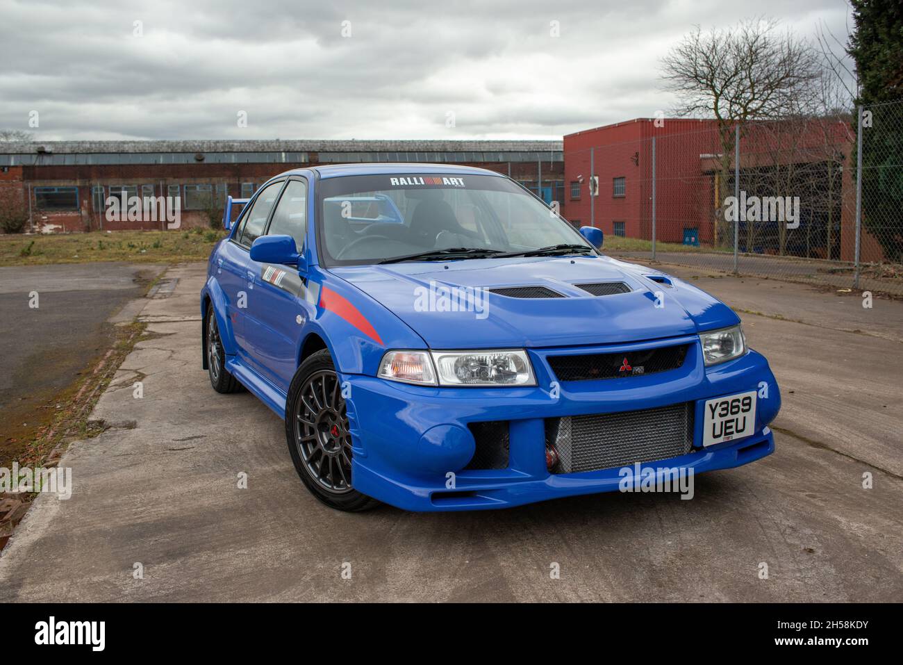 Mitsubishi EVO VI Ralliart GSR parked on a disused industrial site Stock Photo