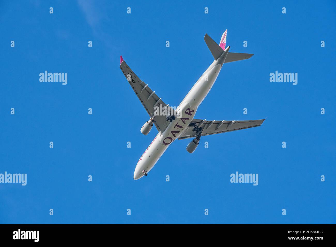 LONDON, UNITED KINGDOM - SEPTEMBER  28, 2021: Qatar Airways Airbus A330 underside image on approach to Heathrow Airport Stock Photo