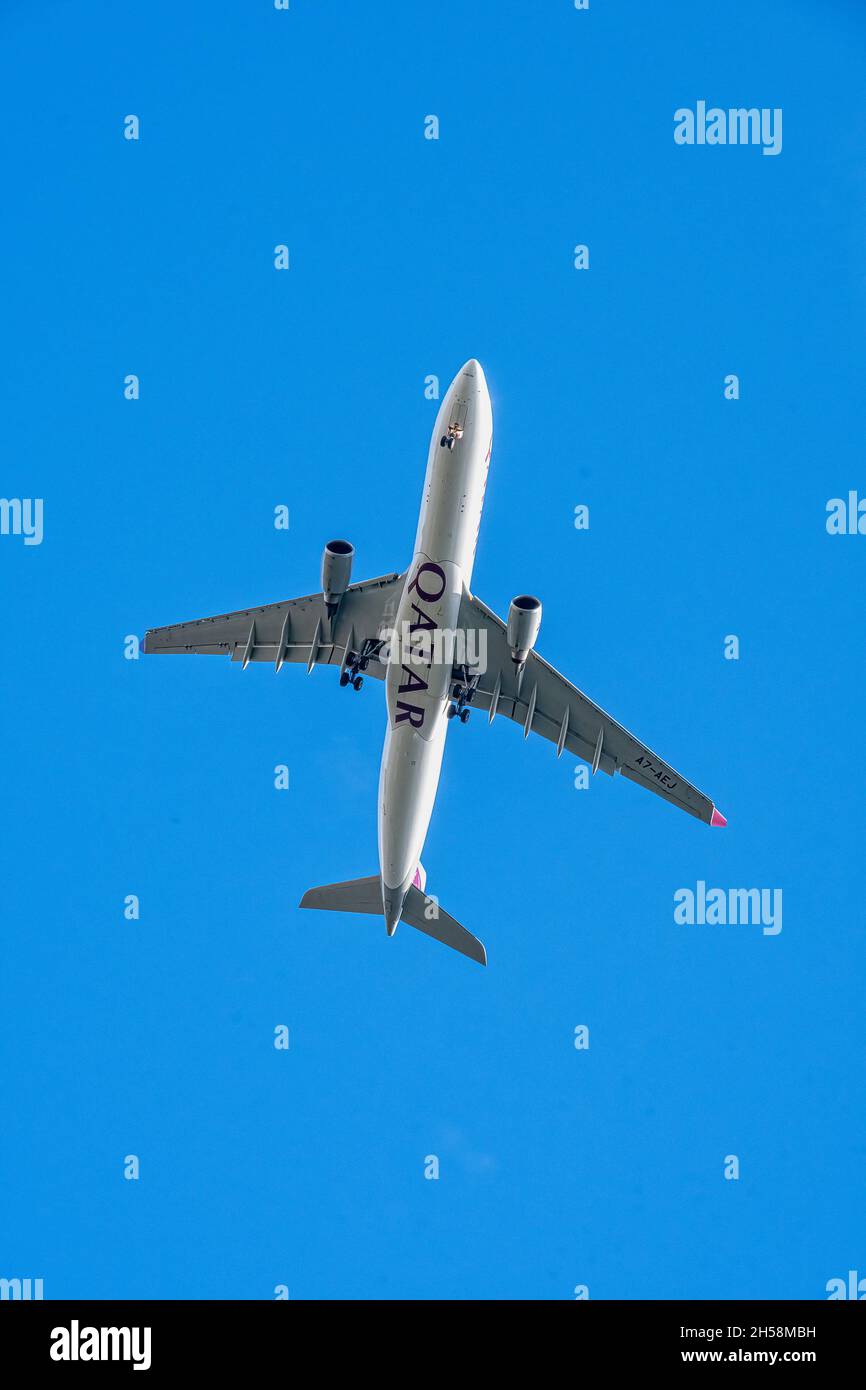 LONDON, UNITED KINGDOM - SEPTEMBER  28, 2021: Qatar Airways Airbus A330 underside image on approach to Heathrow Airport Stock Photo