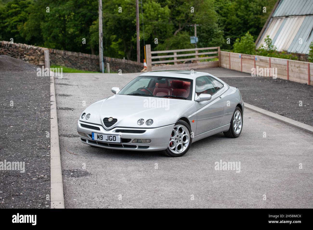 ALFA ROMEO GTV V6 24V Lusso parked on a gravel paddock Stock Photo