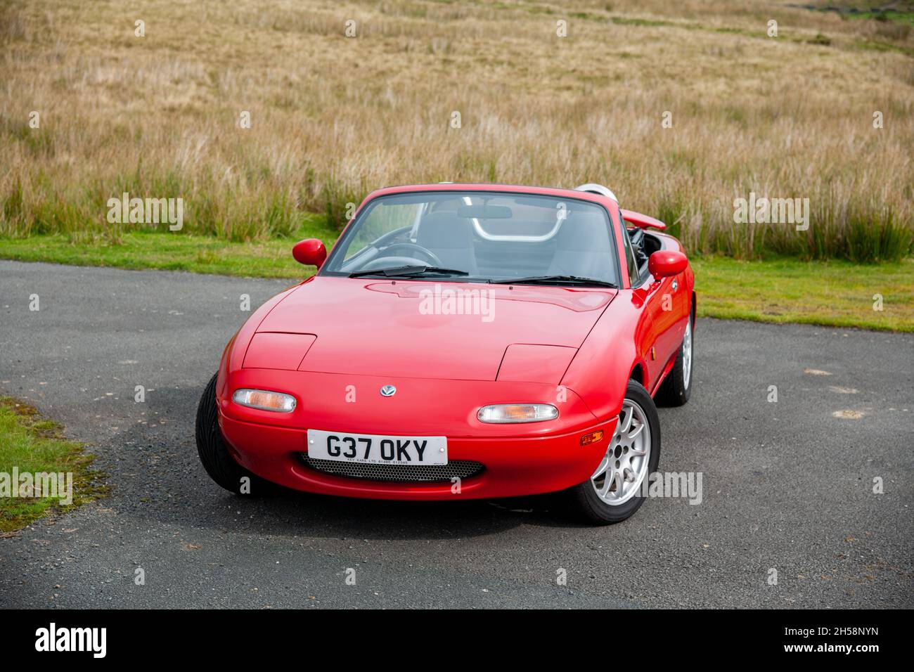 Mazda Eunos MX5 parked on a country lane with fields ...