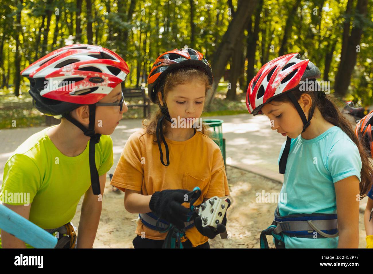 The kids are examining their equipment before start the adventure Stock Photo