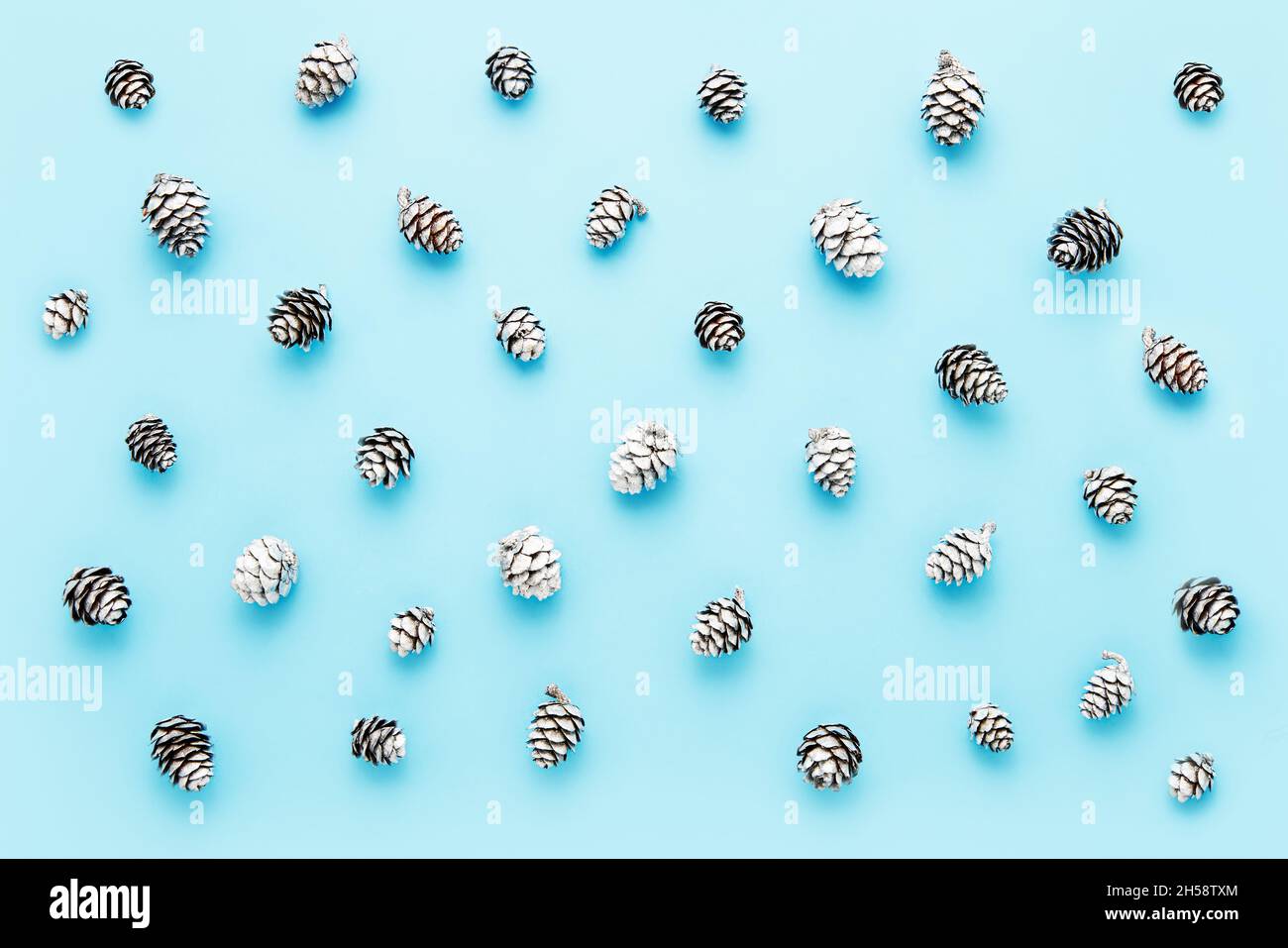 Abstract background. Small silver cones on a light blue background. Top view Stock Photo