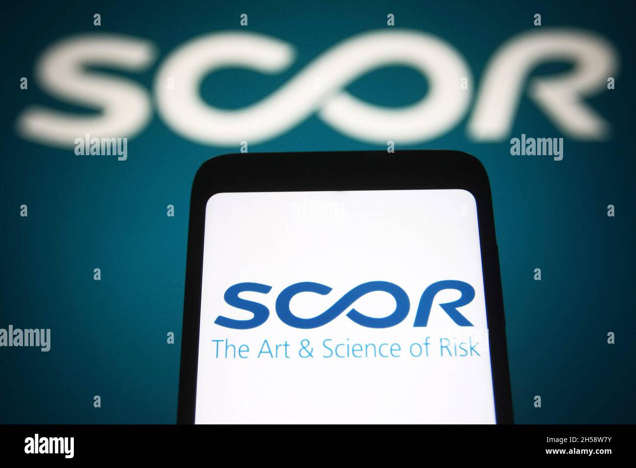 In this photo illustration, a SCOR SE logo is seen on a smartphone ...