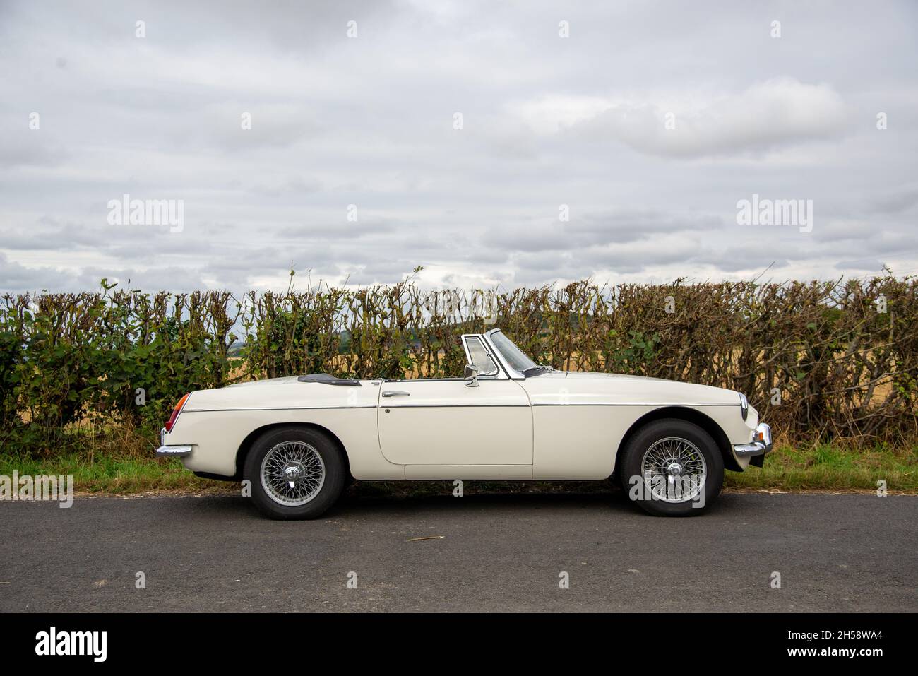Chrome bumper MGB roadster British classic car parked on a country lane