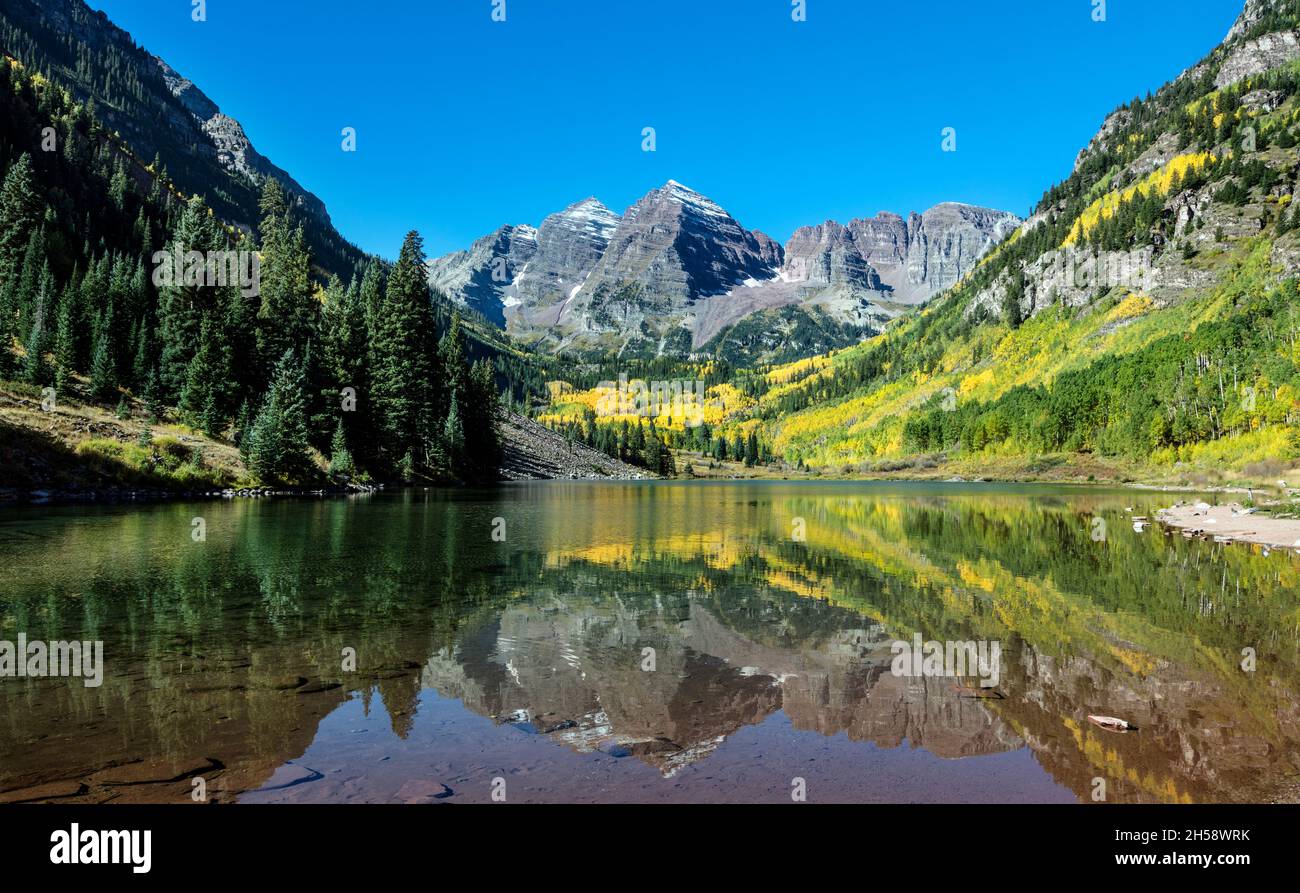 Autumnal view of Rocky Mountain peaks called the Maroon Bells, between Pitkin County and Gunnison County, Colorado. Original image from Carol M. Highs Stock Photo
