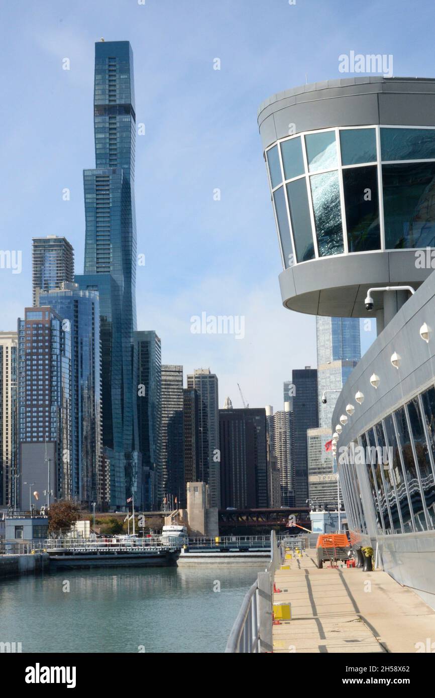 The Lock observation building and the Chicago skyline from the east gate of the Chicago Harbor Lock November 3, 2021 in Chicago, Illinois. The lock is one of only two entrances from the Great Lakes to the Chicago Area Waterway System. Stock Photo