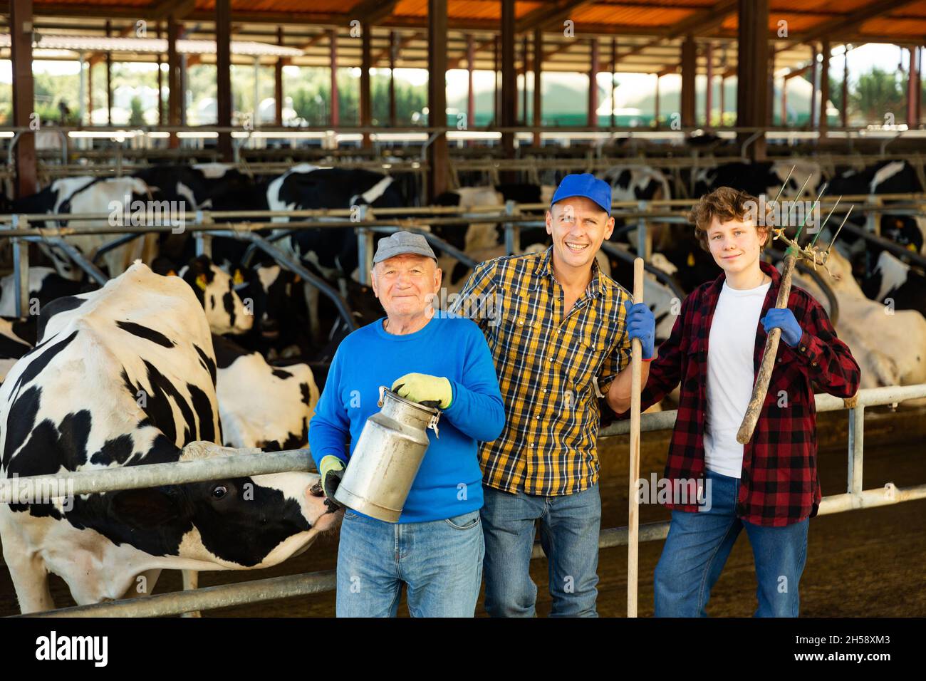 Familyowned livestock business three farmers of different ages in