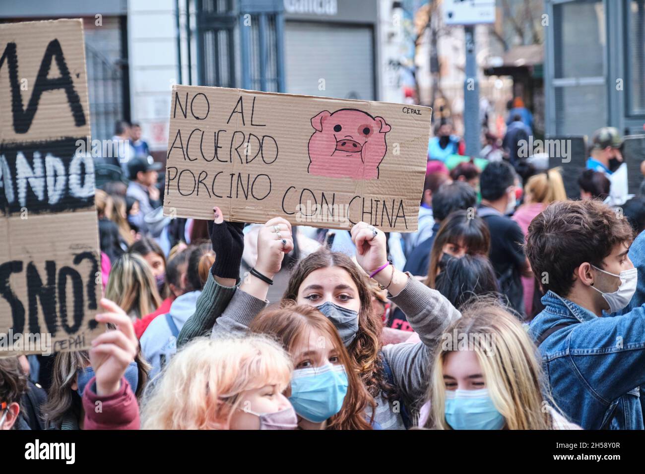 CABA, Buenos Aires, Argentina; Sept 24, 2021: Sign text: No to the pork agreement with China. Young activists protesting during the Global Climate Str Stock Photo