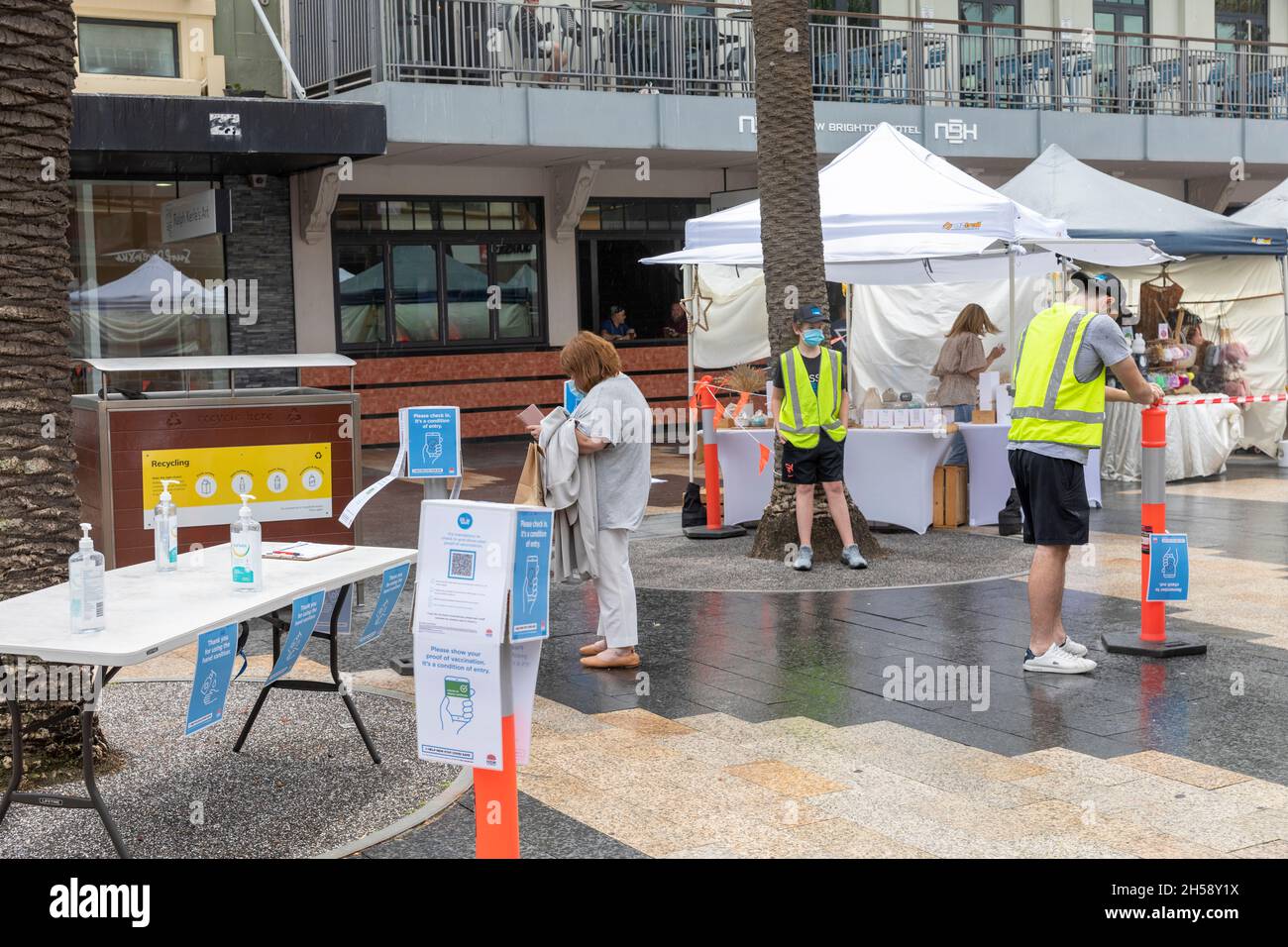 Covid 19 coronavirus check in and sanitiser table for entry to Only Beach farmers market,Sydney in Australia Stock Photo