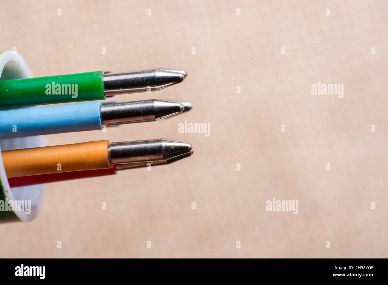 Multi colored pen on a textured background on display stock photo alamy