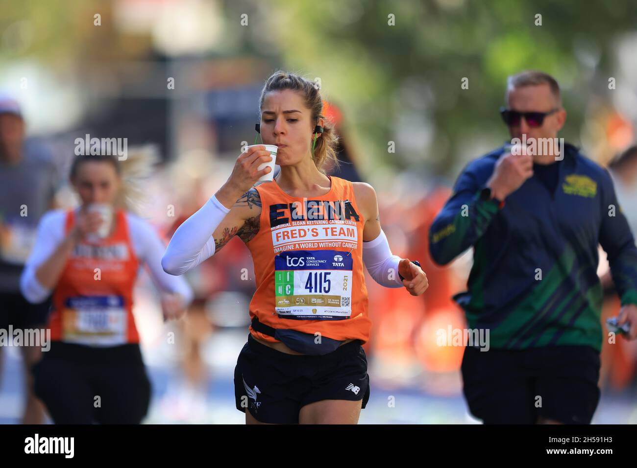 New York, N.Y/USA 7th Nov. 2021 A marathoner holds a cup of water