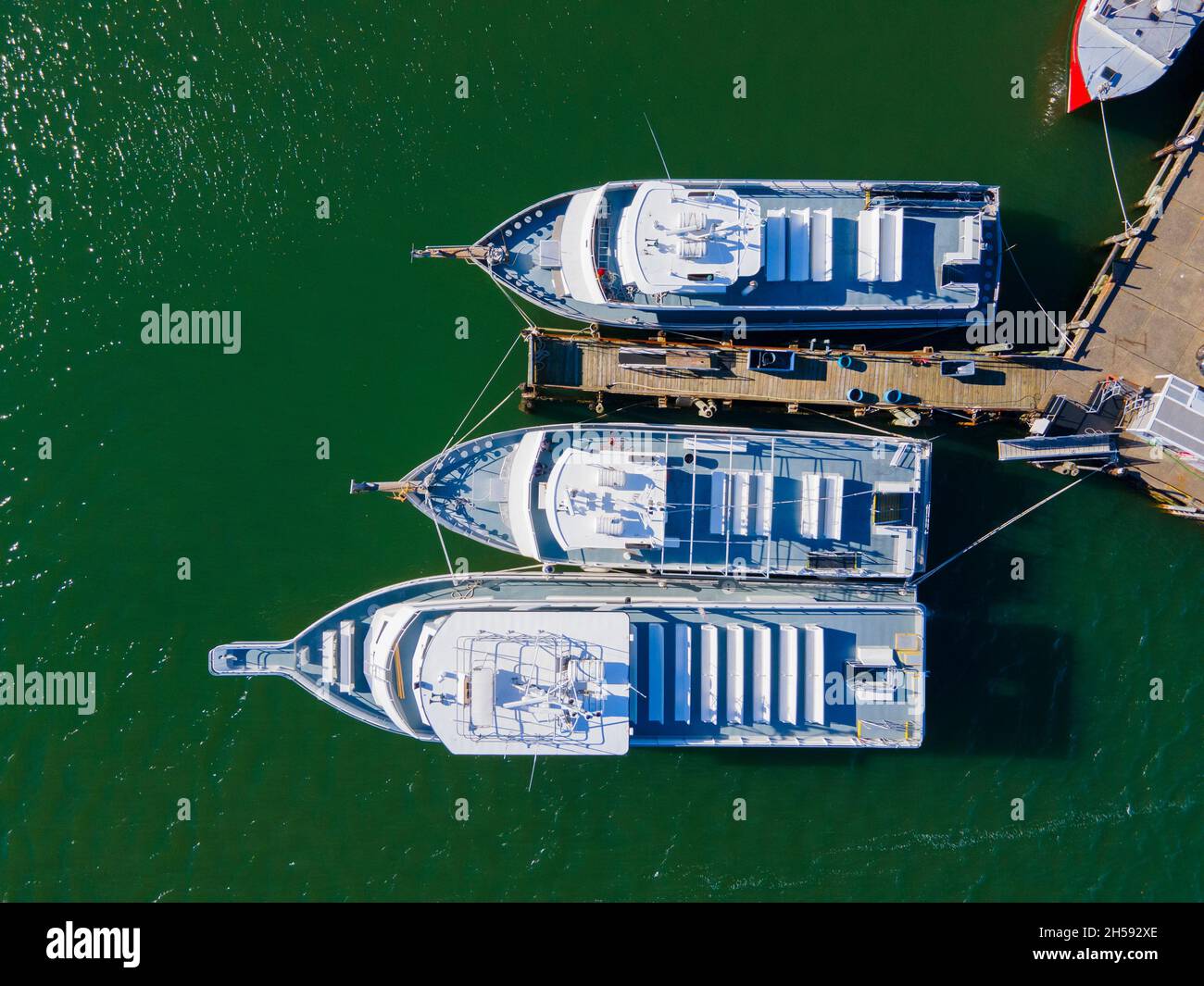 Top view of Whale watch ship docked at Town Wharf at historic town center of Plymouth, Massachusetts MA, USA. Stock Photo