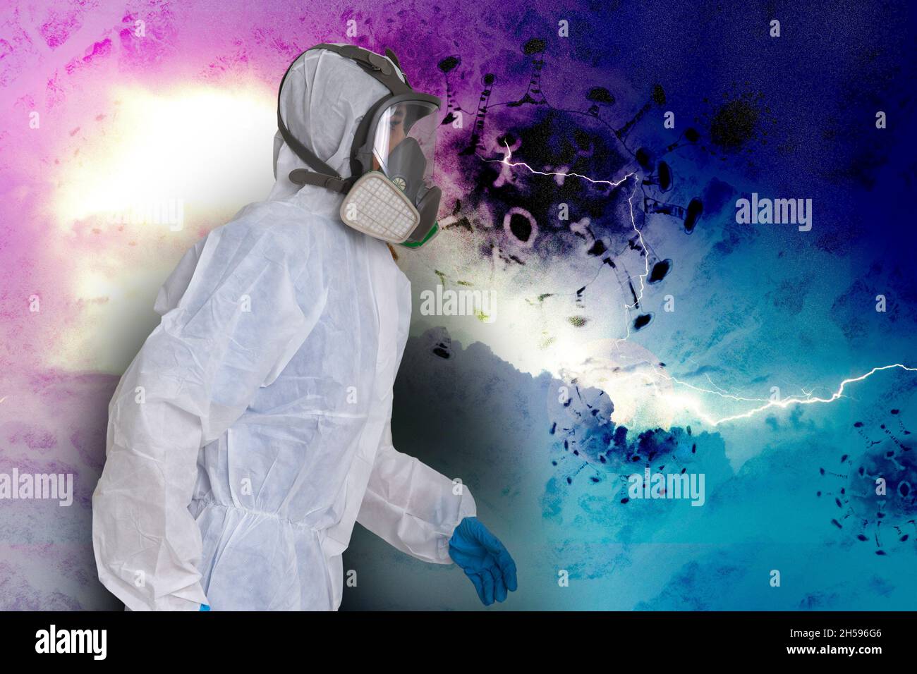 Female officer wearing PPE protection suit to avoid covid-19 infection on terrify background. Stock Photo