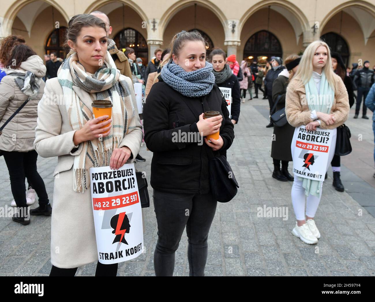 Krakow, Poland. 07th Nov, 2021. Protesters seen with abortion flyers during the protest. Thousands take to the streets of Poland in protest after the death of 30-year-old Izabela (Iza), who died in the 22nd week of pregnancy because doctors did not abort the dying fetus under the anti-abortion law. Credit: SOPA Images Limited/Alamy Live News Stock Photo