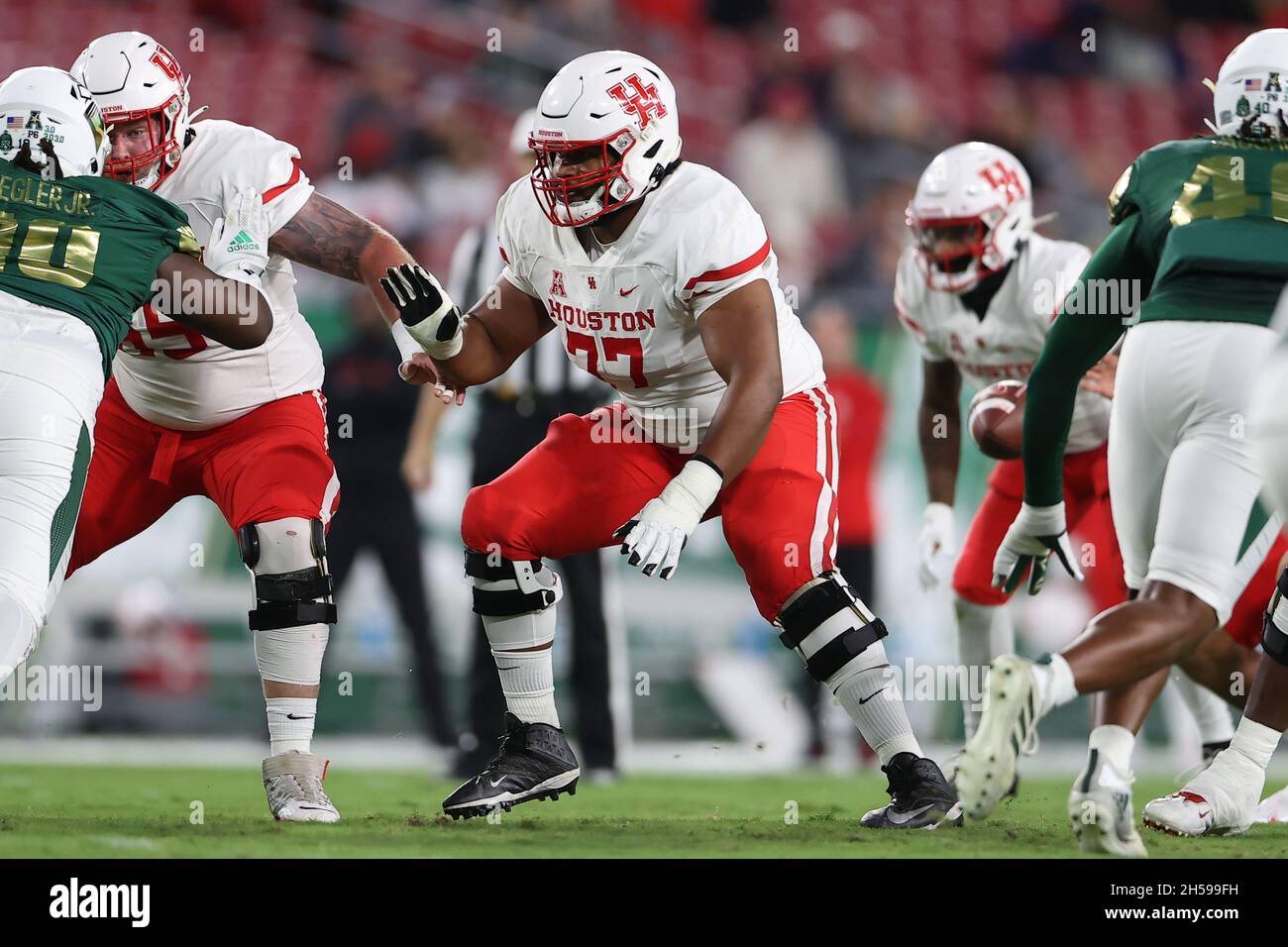 Tampa, FL, USA. 6th Nov, 2021. Houston Cougars offensive lineman Keenan Murphy (77) blocks during the game between the Houston Cougars and the South Florida Bulls at Raymond James Stadium in Tampa, FL. (Photo by Peter Joneleit). Credit: csm/Alamy Live News Stock Photo