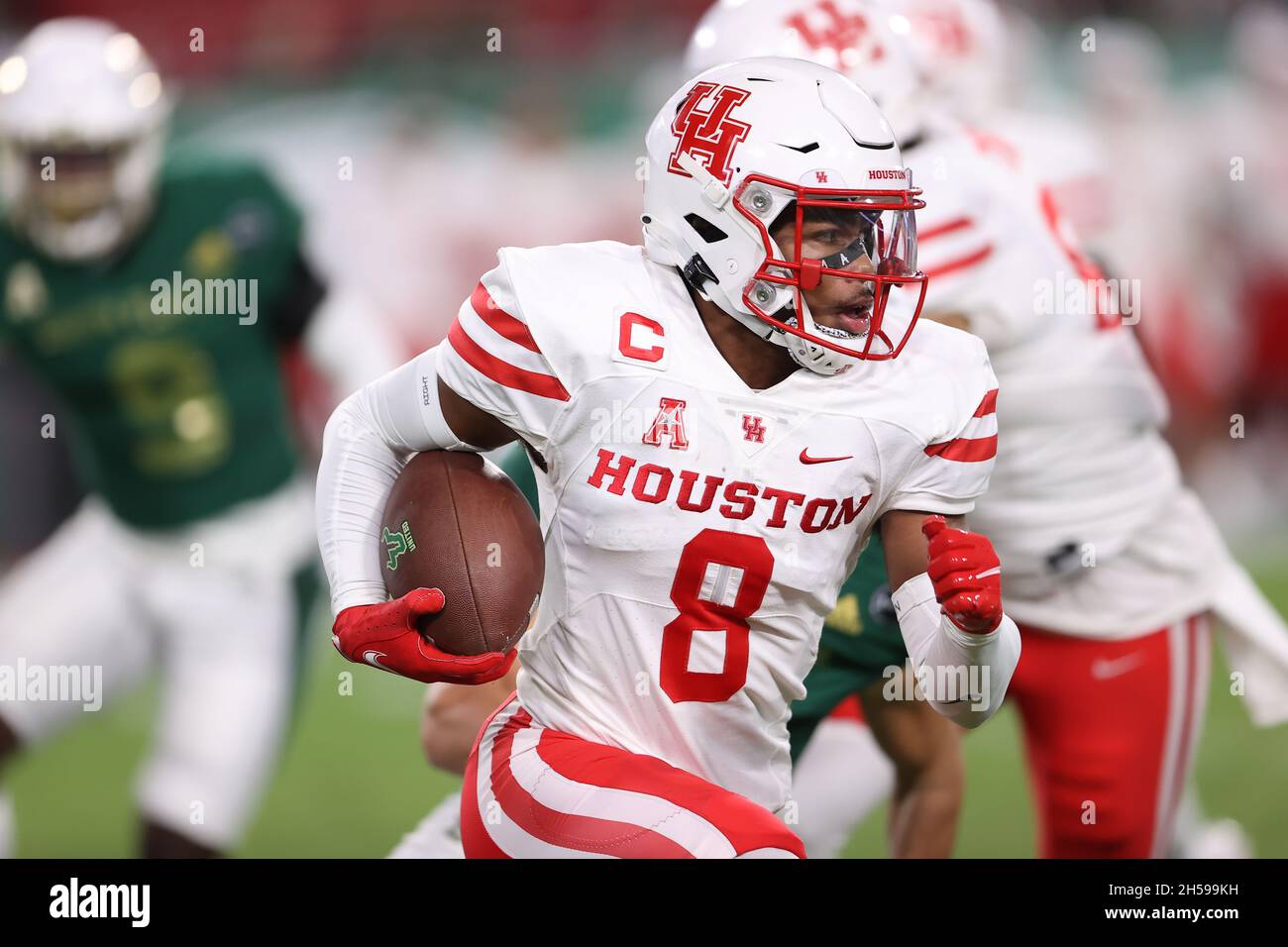 Tampa, FL, USA. 6th Nov, 2021. Houston Cougars cornerback Marcus Jones (8) returns a kickoff during the game between the Houston Cougars and the South Florida Bulls at Raymond James Stadium in Tampa, FL. (Photo by Peter Joneleit). Credit: csm/Alamy Live News Stock Photo