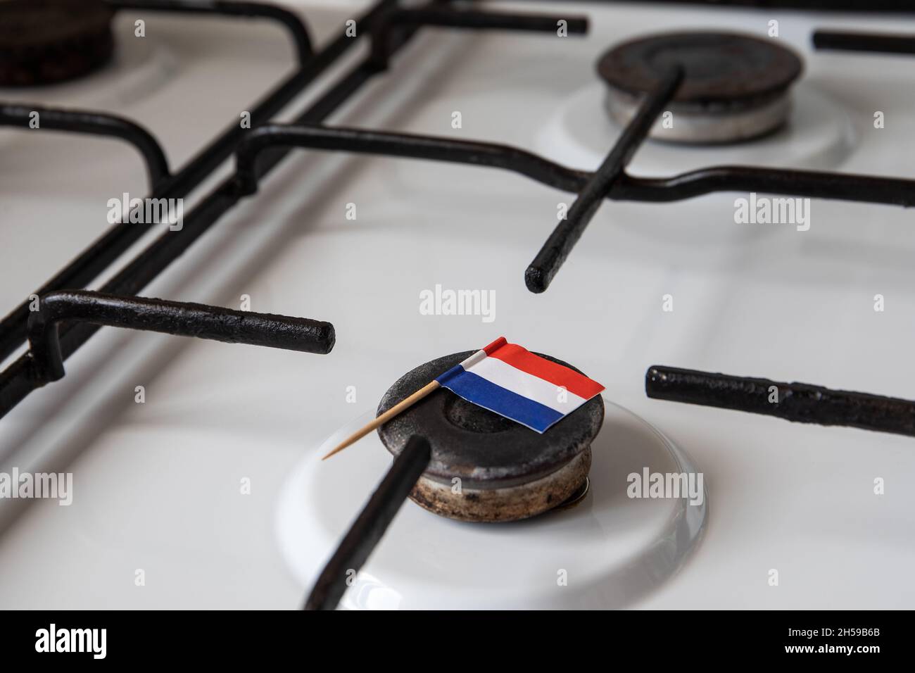 Natural gas exports and imports. High price. Flag of the Netherlands on