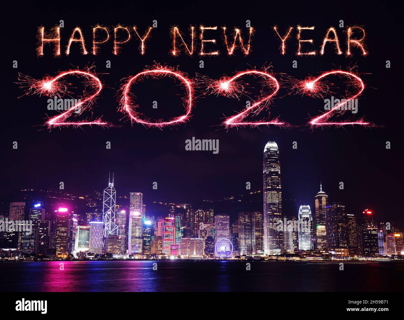 2022 Happy New Year fireworks celebrating over Hong Kong cityscape at