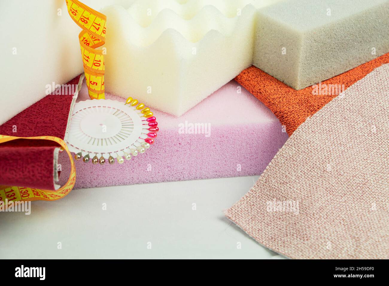 a piece of foam rubber of different sizes and colors, production of upholstered furniture Stock