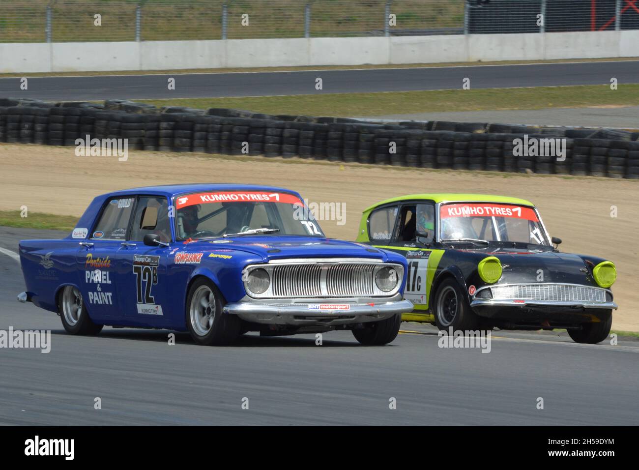 Campbell Gould Ford Zephyr Mark 3 and a Ford Anglia in the Pre 65 race at Hampton Downs, 14 January 2017, Tasman Revival organised by HRC. Stock Photo