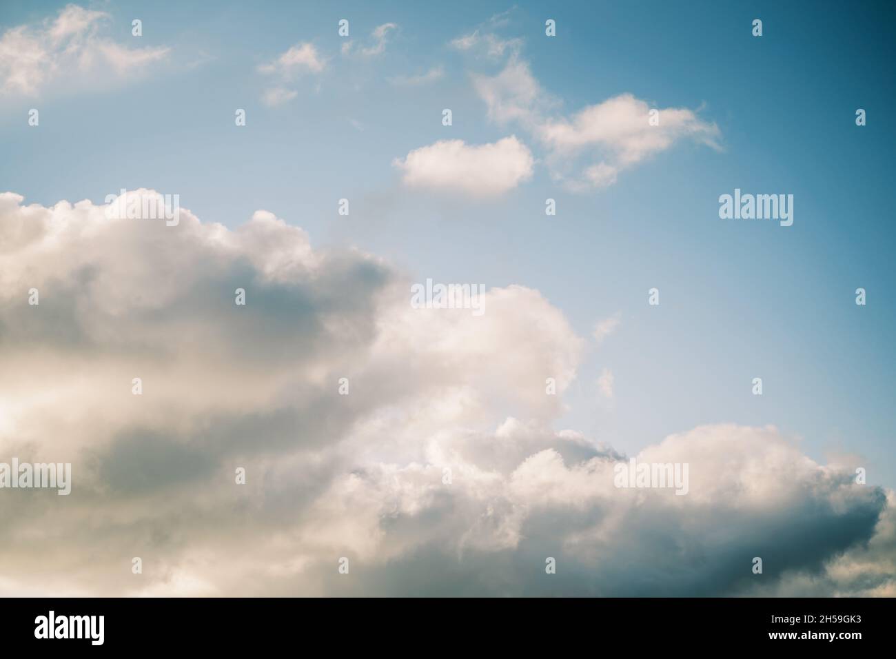 Clouds on the blue sky during sunset Stock Photo - Alamy