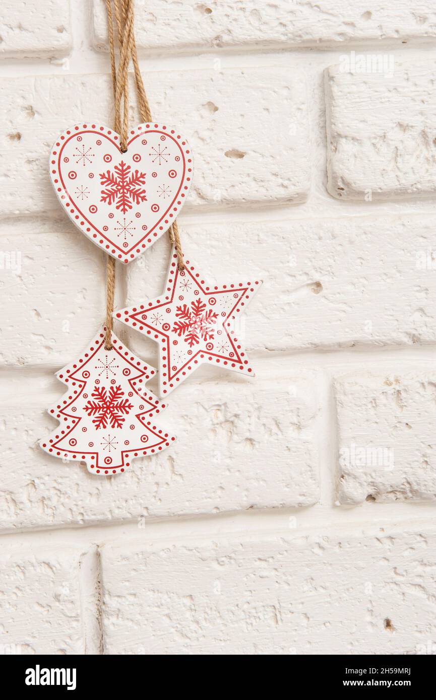 Wooden christmas decorations on white brick wall Stock Photo Alamy