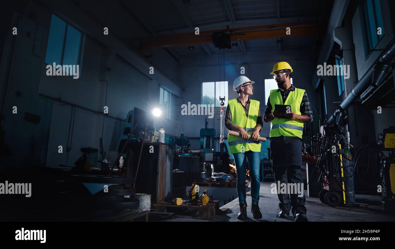 Portrait of industrial inspectors with tablet doing a general check up ...