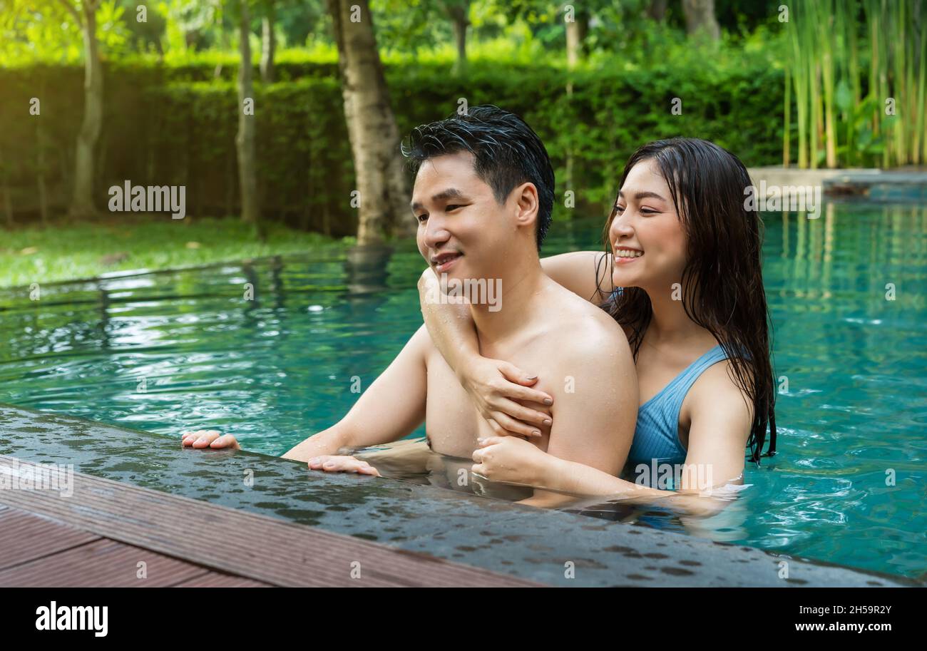 young couple having fun in swimming pool Stock Photo