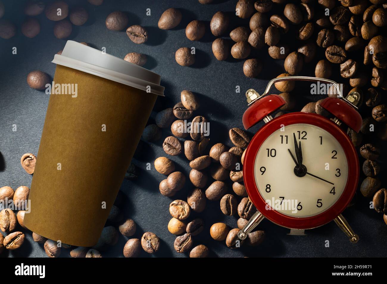 Photo of a paper coffee cup with a mixture of arabica and robusta beans ...