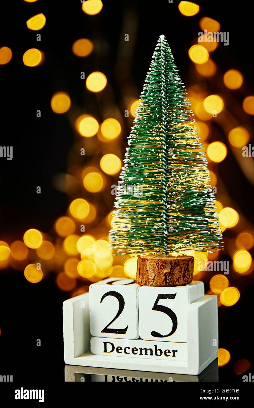 Merry Christmas And Happy New Year Composition. Small Toy Christmas Tree On Dark Background With Garland Lights. Beautiful Greeting Cart And Banner. 2022 New Year Concept Stock Photo - Alamy