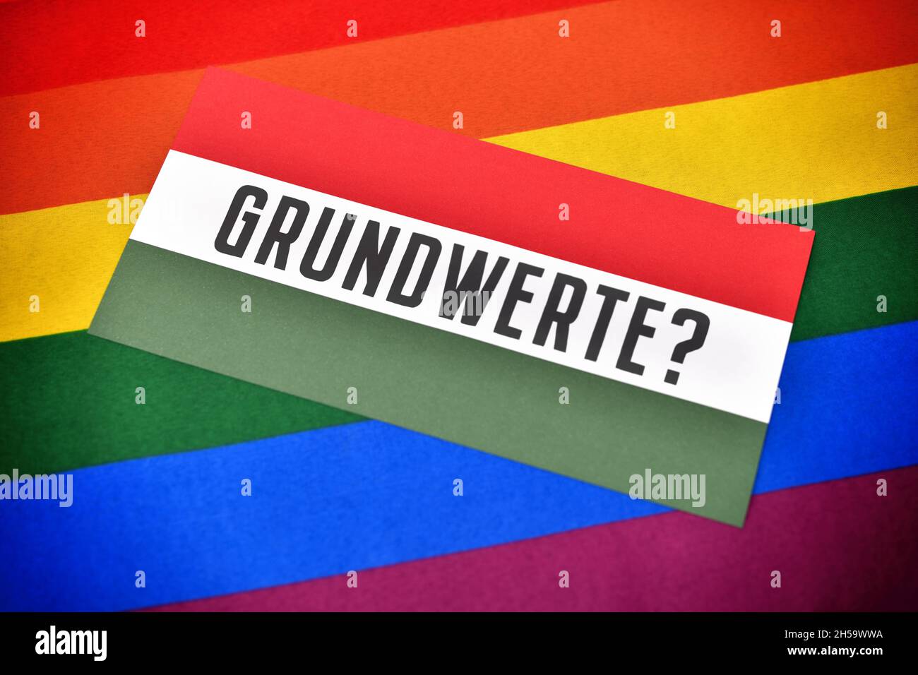 FOTOMONTAGE, Fahne von Ungarn mit der Aufschrift Grundwerte und Regenbogenfahne Stock Photo