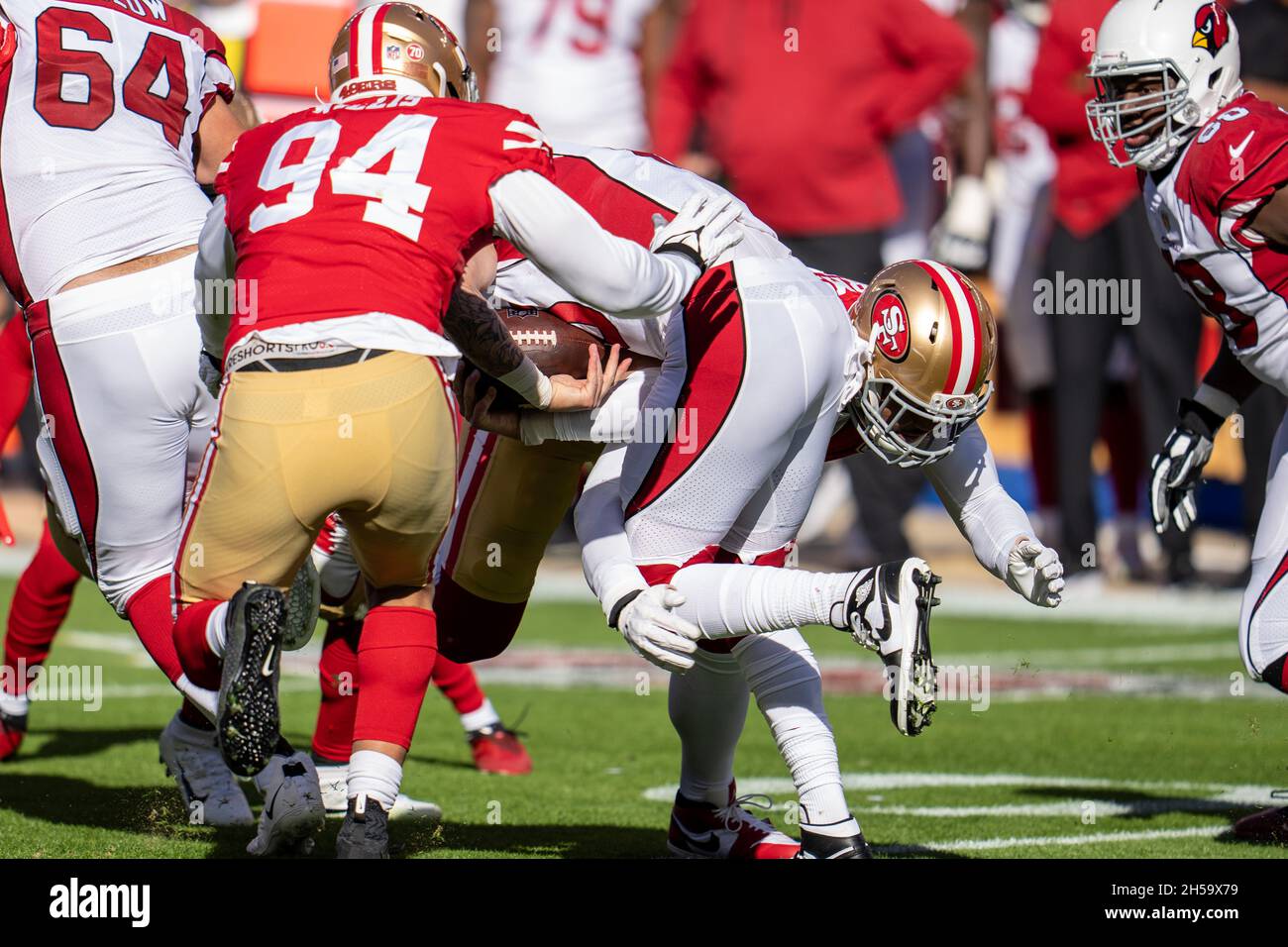 Arizona Cardinals quarterback Chris Streveler (15) is tackled by San Francisco 49ers defensive end Arik Armstead (91) during the first quarter in San Stock Photo