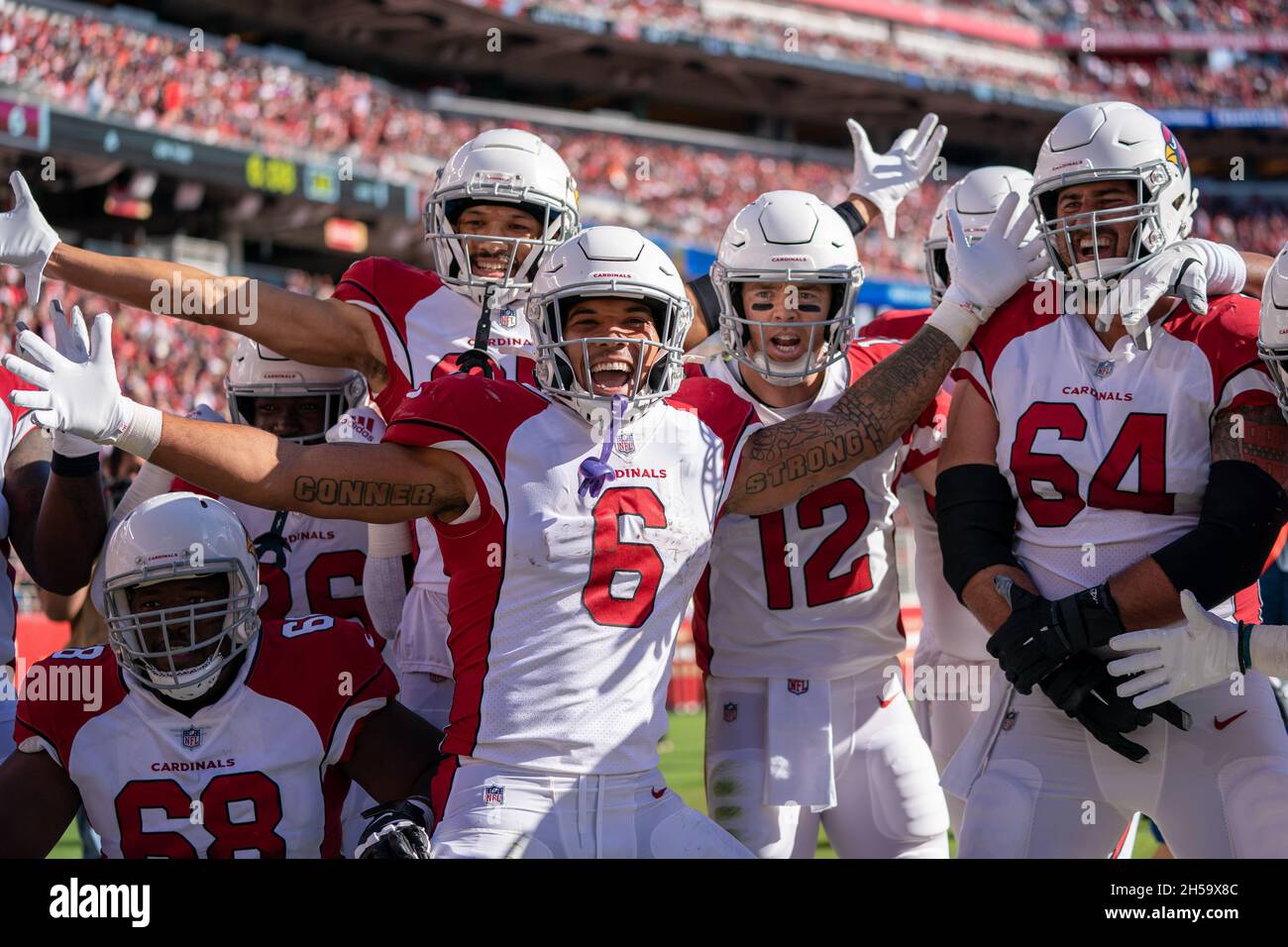 Arizona Cardinals running back James Conner (6) celebrates with teammates quarterback Colt McCoy (12) and guard Sean Harlow (64) and offensive tackle Stock Photo