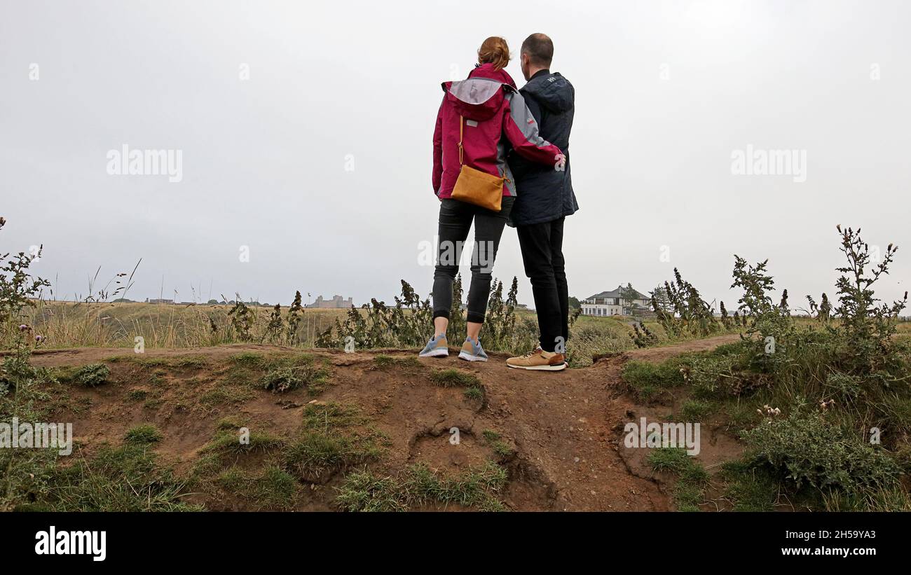Young couple viewing Tantallon castle from a distance Stock Photo