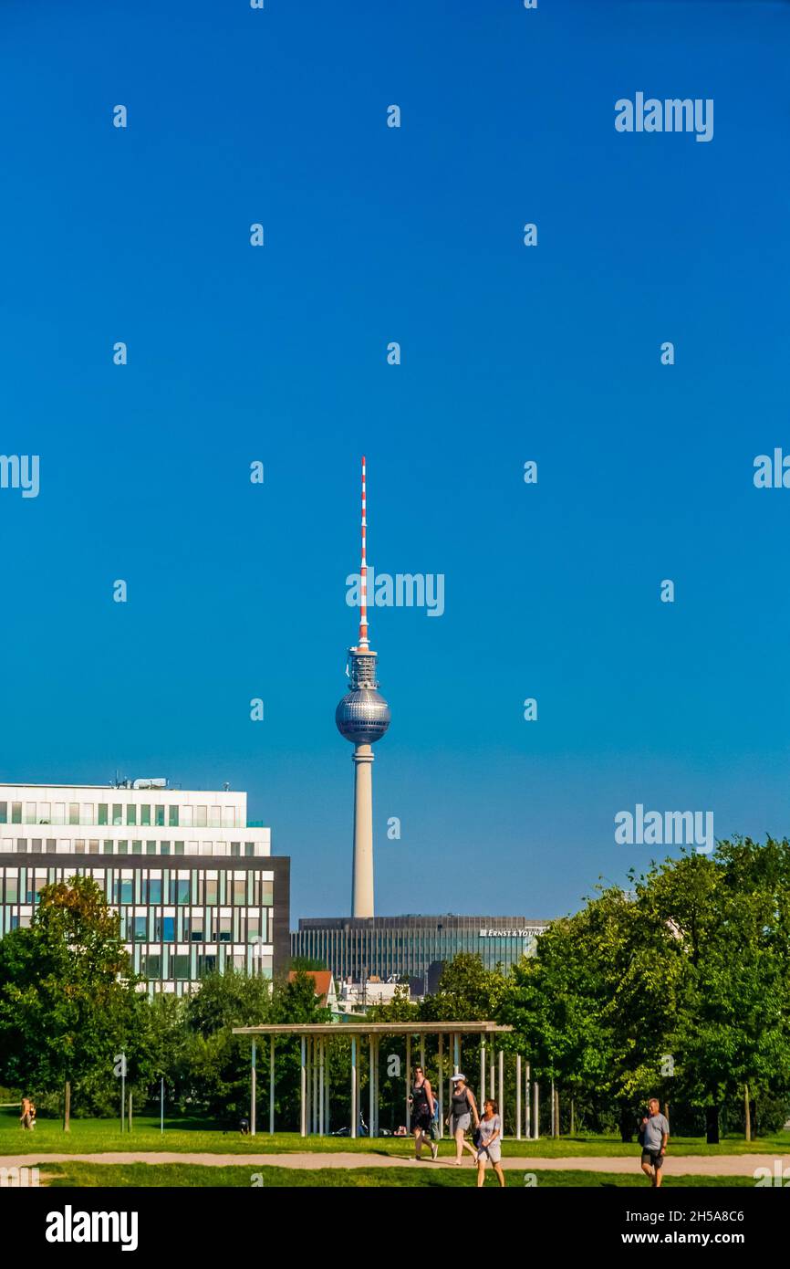 Beautiful view of the Berlin Television Tower (Berliner Fernsehturm) with its impressive sphere and spire in the background of the capital city in... Stock Photo