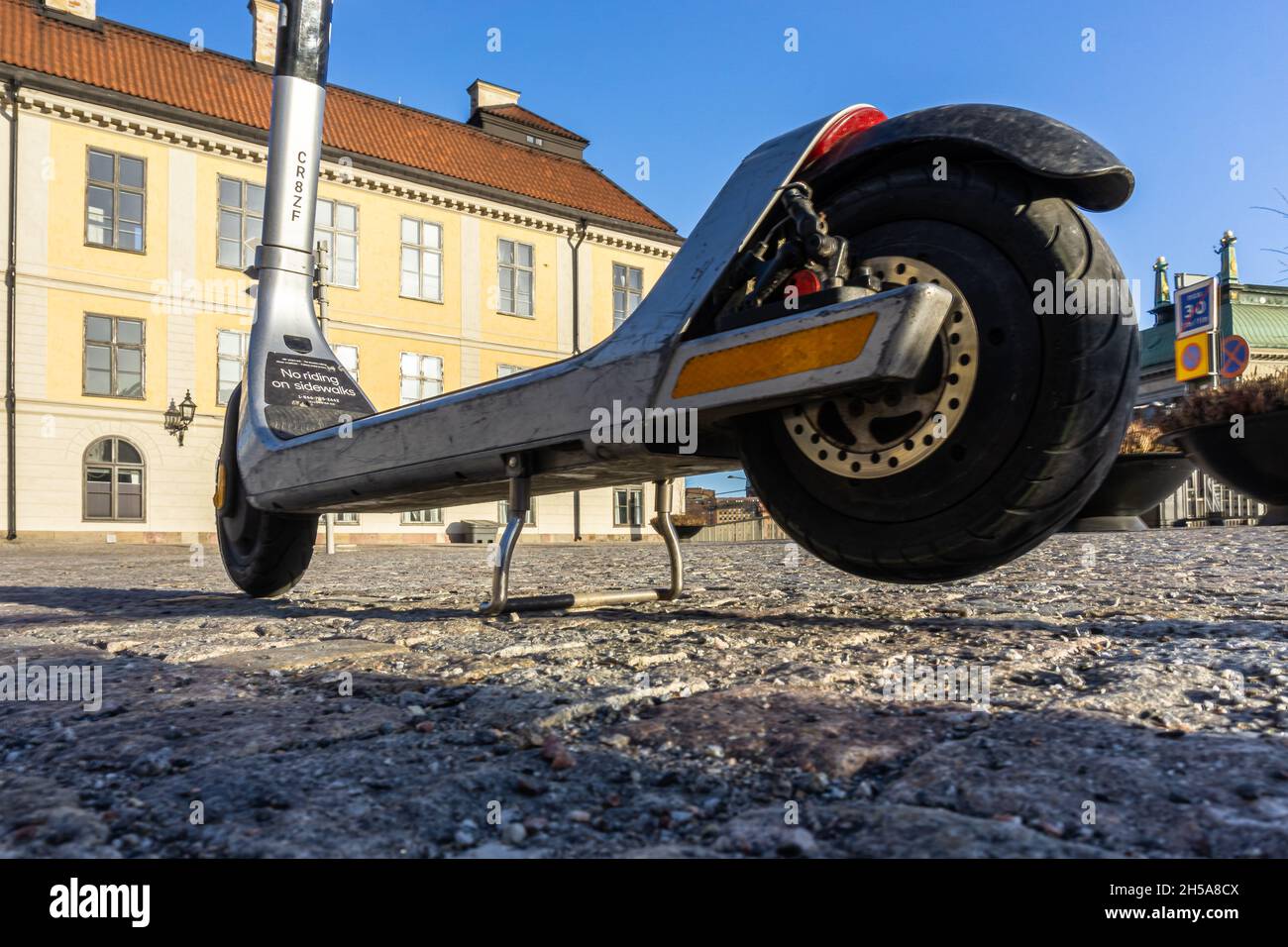 Stockholm, Sweden - April 3, 2021: Close up of tires and electrical rent-a-scooter as a part of transportation offer in Stockholm Stock Photo