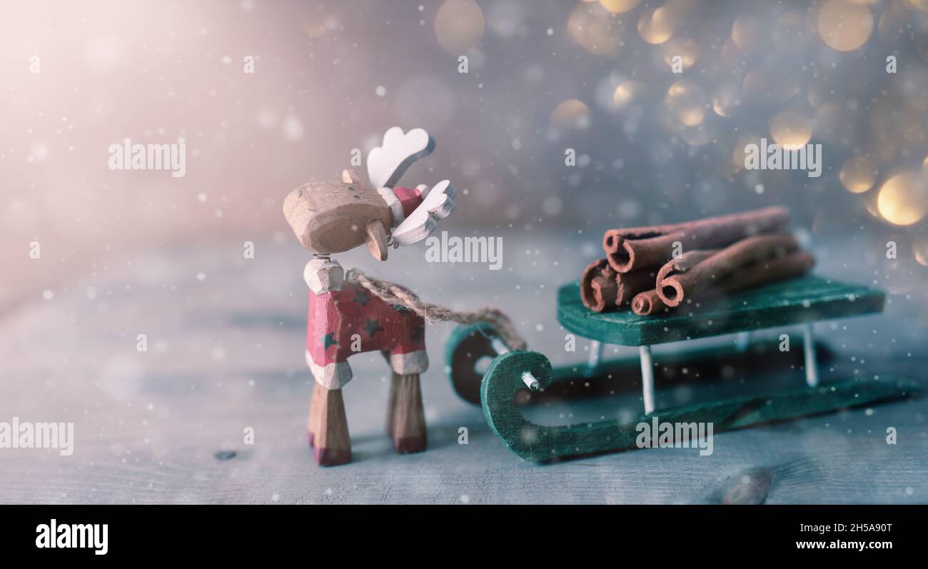 Christmas holiday background with toy moose and sledge. Stock Photo