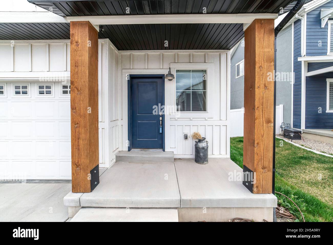 Exterior of a house with white board and batten siding Stock Photo Alamy