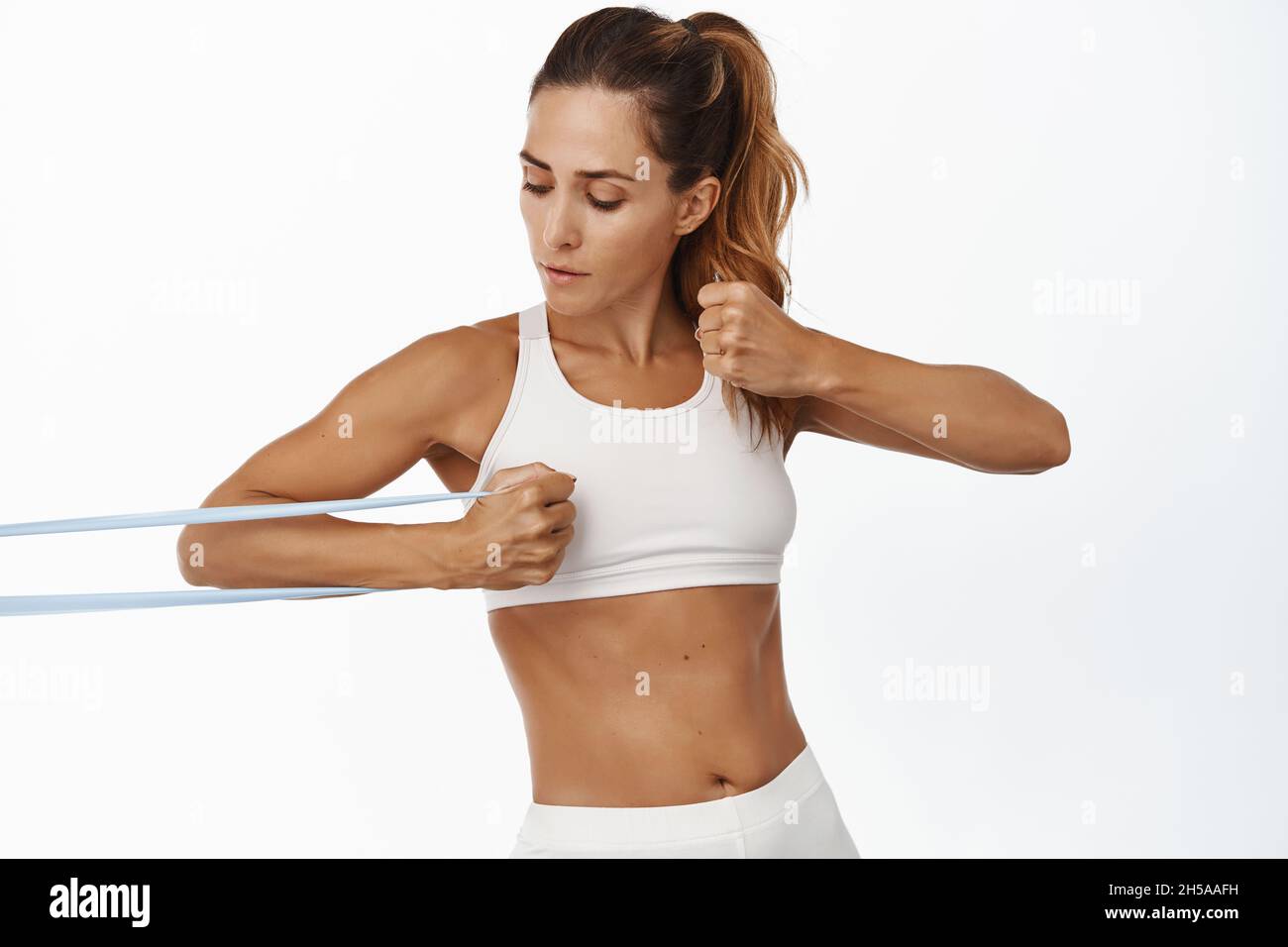 Abs resistance band woman hi-res stock photography and images - Alamy