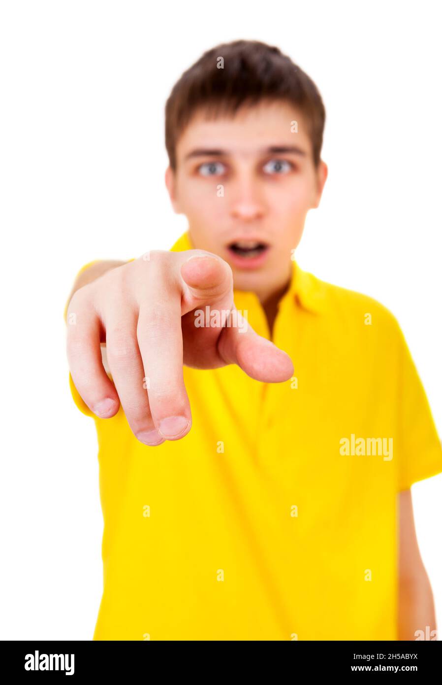 Surprised Young Man looking and pointing at You on the White Background ...