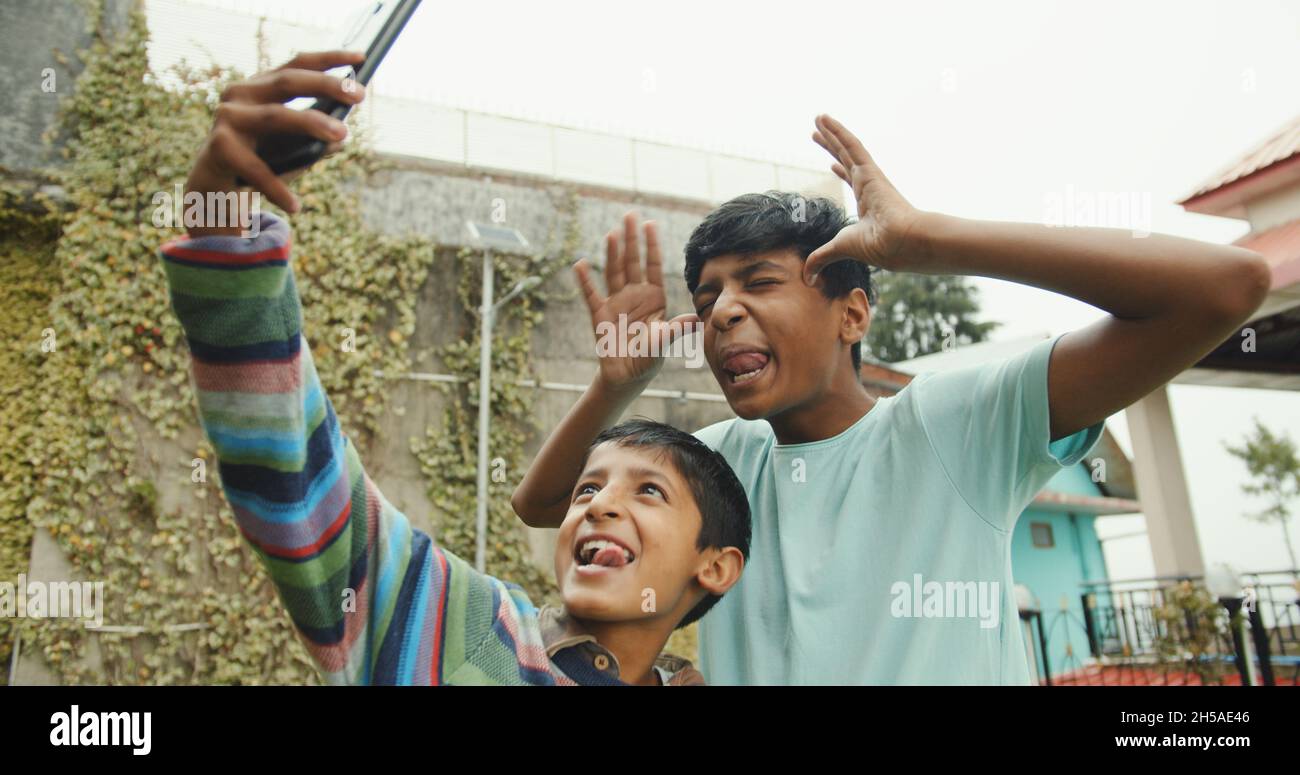 little-brothers-from-india-taking-a-funny-selfie-in-shimla-himachal