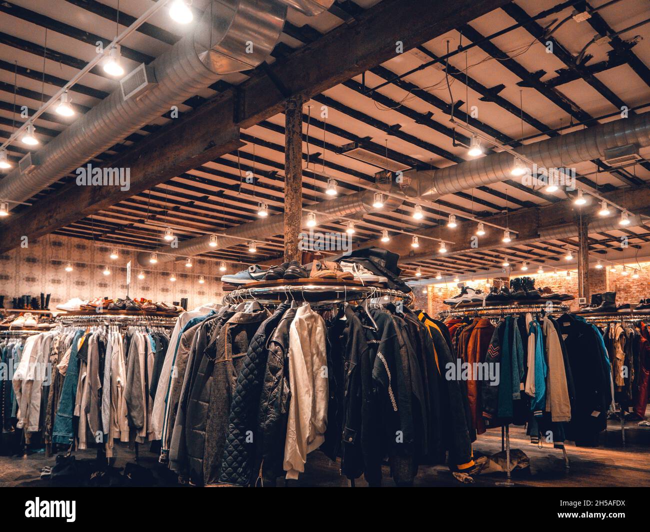 Many racks in a Thrift shop Stock Photo