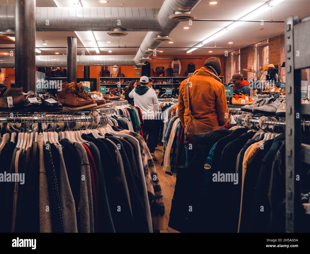 Inside a thrift shop for clothes Stock Photo