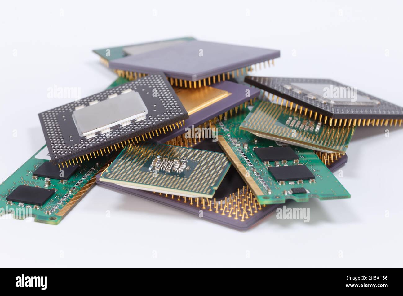 Old CPUs and memory modules heap on a white background (И Stock Photo