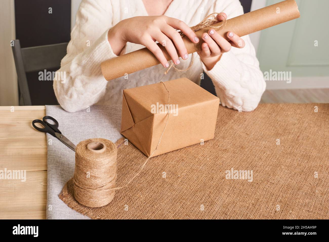 Popular in many fields, kraft paper twisted into a roll, kraft paper for  packing parcels, gifts, food, top view Stock Photo